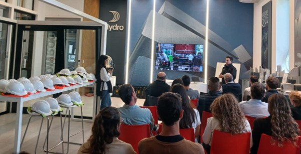 a group of people watching a person on a stage