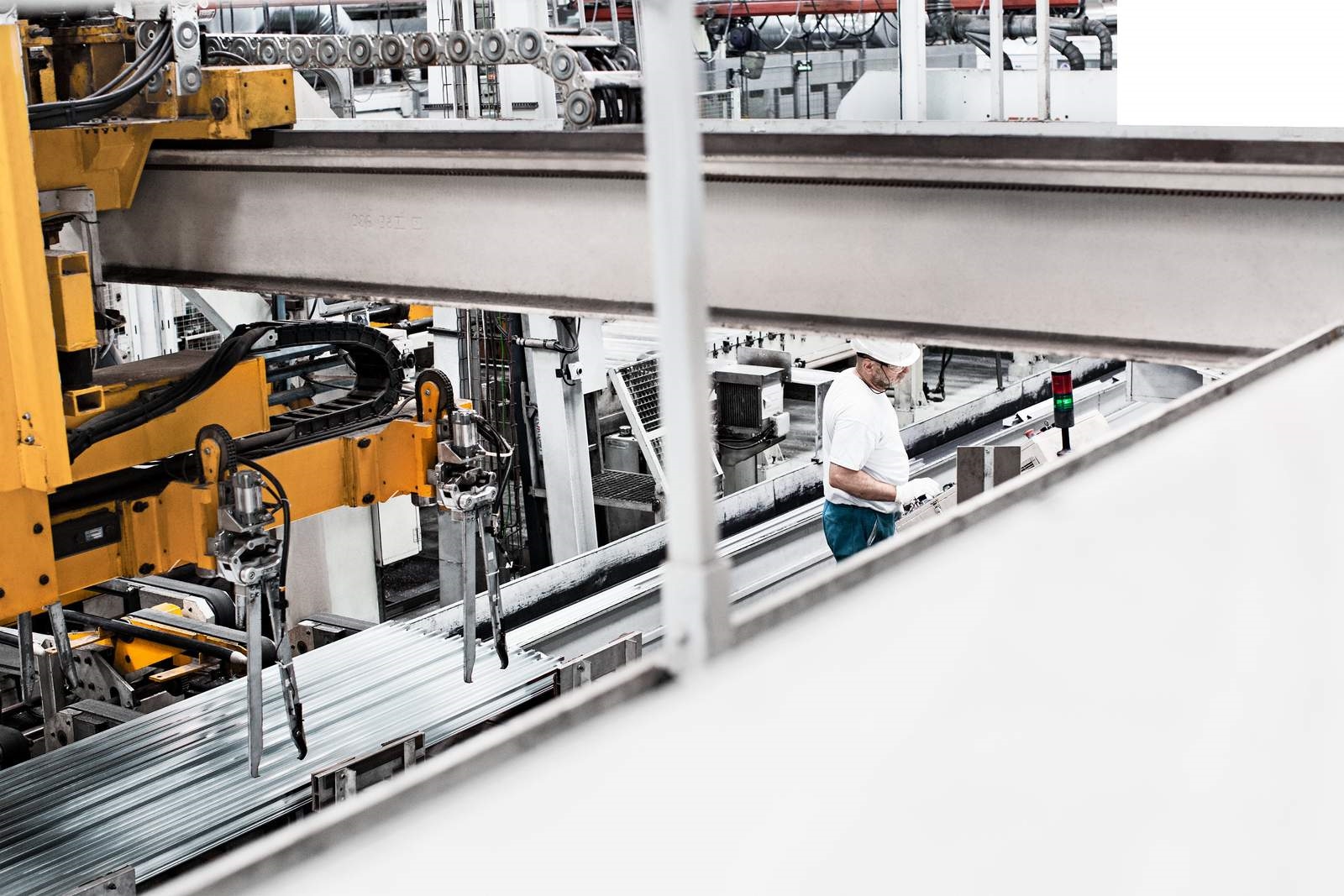 Employee working inside aluminum extrusion plant