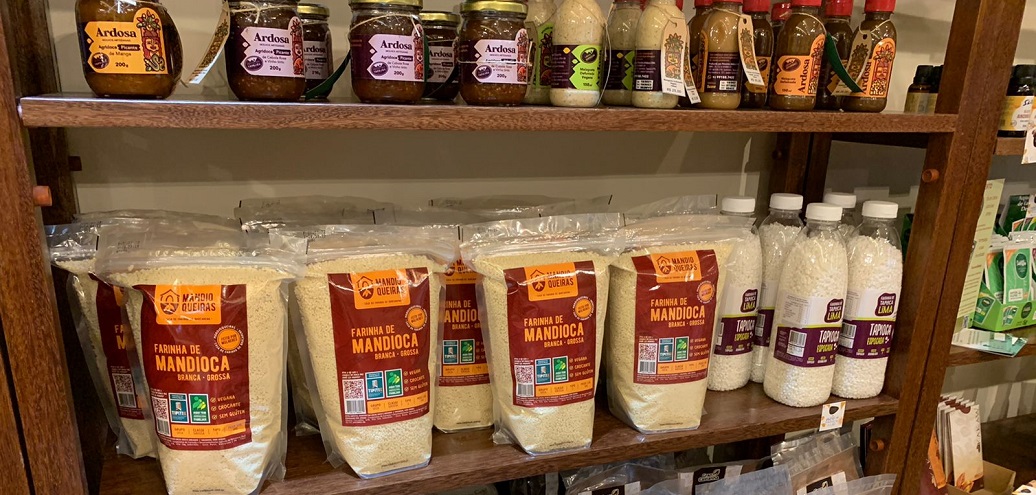 a shelf with many jars of food on it