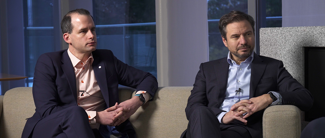 men sitting on a couch